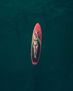 woman, lying on a surfboard, sea, ocean, nature, aerial view, standup paddleboard, surfboard, aerial photography